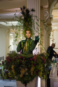 Savor The Story 2017 - a woman posing as a plant with grapes around her