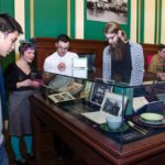 People looking in cases at the On The Table opening at Providence Public Library