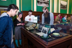 People looking in cases at the On The Table opening at Providence Public Library