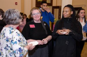 People looking in cases at the On The Table opening at Providence Public Library