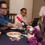 Beatrice Pulliam handing out pins at Providence Public Library