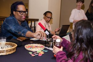 Beatrice Pulliam handing out pins at Providence Public Library
