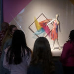 Teen Squad members look at a window display at Nordstrom