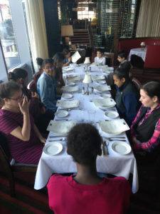 Teens dining at the Genesis Center as part of the Teen Squad culinary arts program