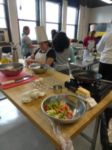 Teen Squad members working in a kitchen