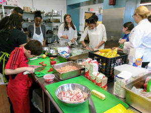 Teen Squad members working in a kitchen