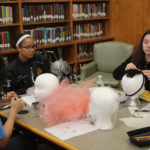 Teen Squad members working on their headdresses