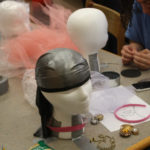 Teen Squad members working on their headdresses