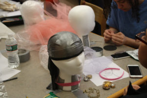 Teen Squad members working on their headdresses