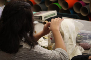 Teen Squad members working on their headdresses