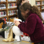 Teen Squad members working on their headdresses