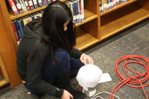 Teen Squad members working on their headdresses