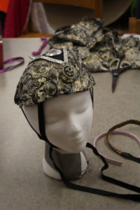 A headdress on a mannequin made as part of the Teen Squad Turbans to Tiaras program