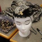 A headdress with a 1920s style flapper headdress on it