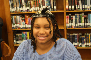 A Teen Squad participant wearing a headdress she made