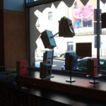 A window display of books prepared as part of the Visual Merchandising program at Providence Public Library
