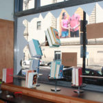 A window display of books prepared as part of the Visual Merchandising program at Providence Public Library