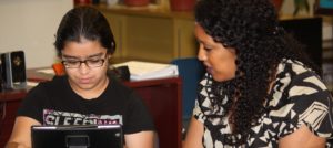Teen receives help in Library Teen Squad program.