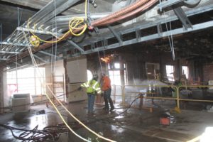 Jackhammering for 3-story Atrium Stair