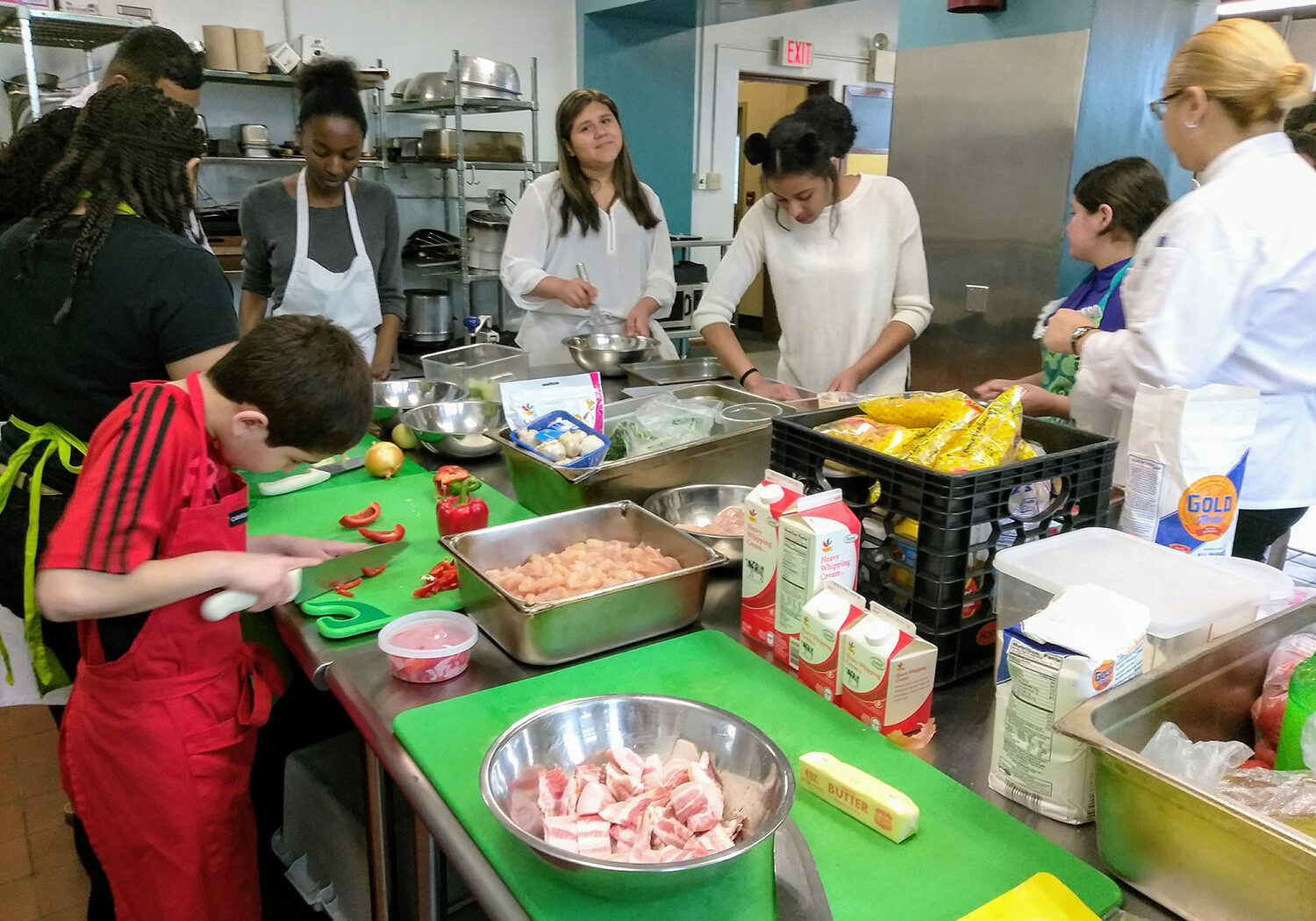 Teen Squad members working in a kitchen