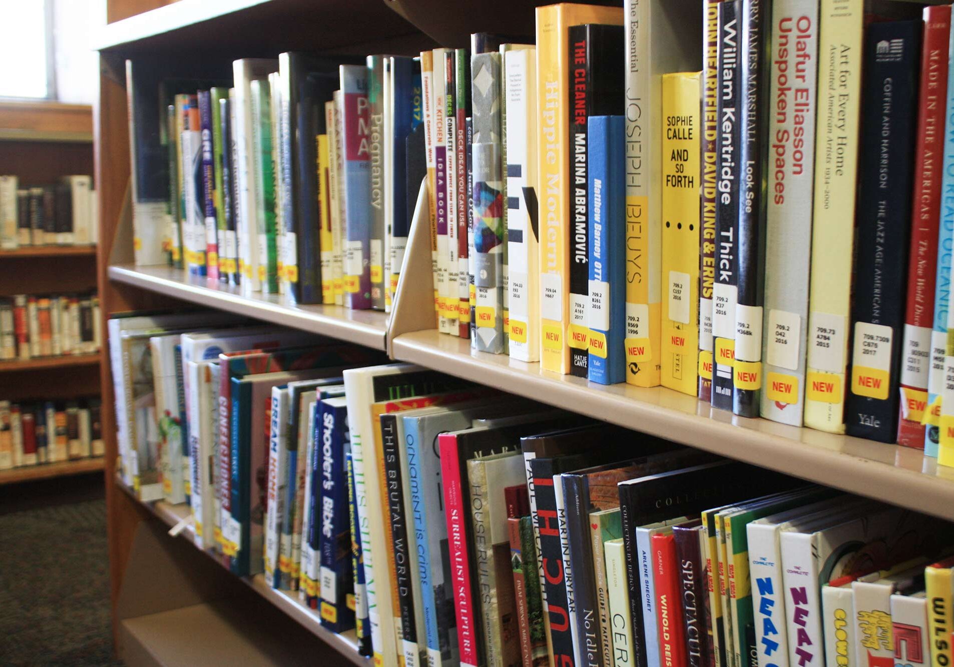 Books in the new books section of Providence Public Library